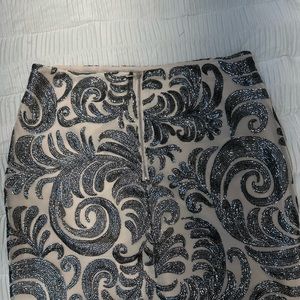 Chic Metallic silver design skirt; dress it up with a any top new Missing tag .